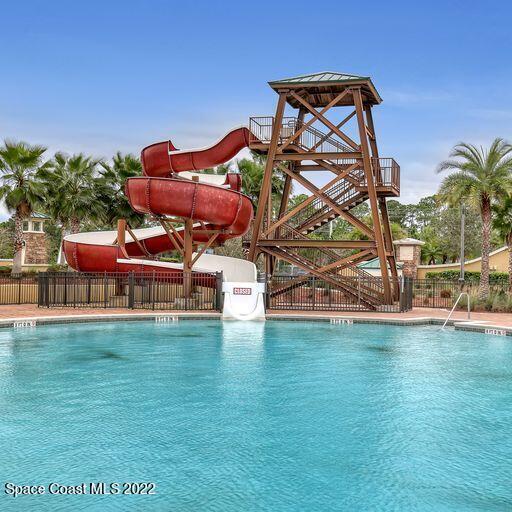 view of pool featuring a water slide