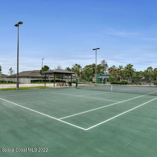 view of tennis court with a gazebo