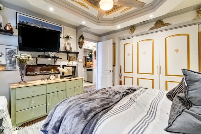 bedroom featuring ceiling fan, a closet, and crown molding