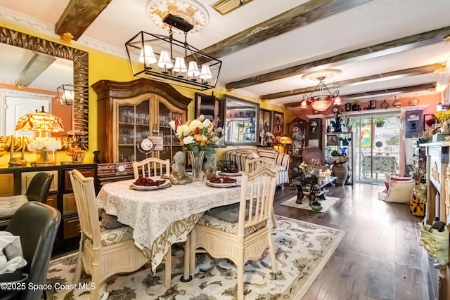 dining room featuring dark wood-type flooring, beam ceiling, and ornamental molding