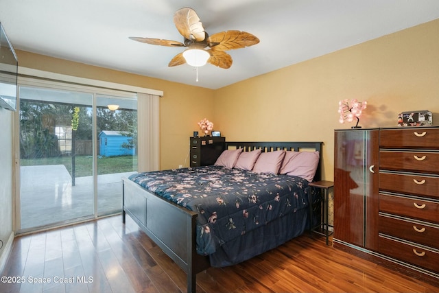 bedroom featuring ceiling fan, dark hardwood / wood-style flooring, and access to outside