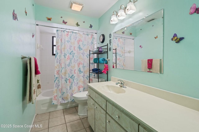 full bathroom featuring toilet, tile patterned floors, vanity, and shower / tub combo with curtain