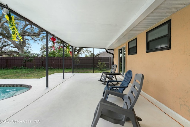 view of patio with a fenced in pool