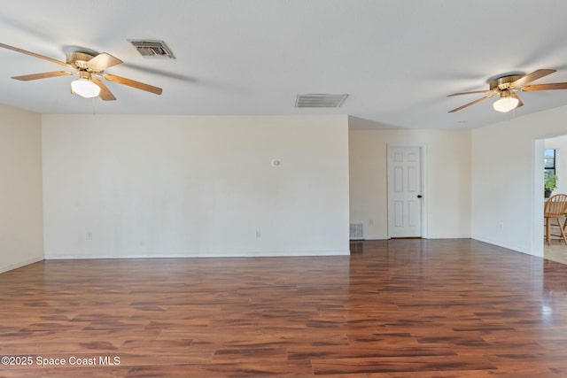 unfurnished room with ceiling fan and dark hardwood / wood-style floors