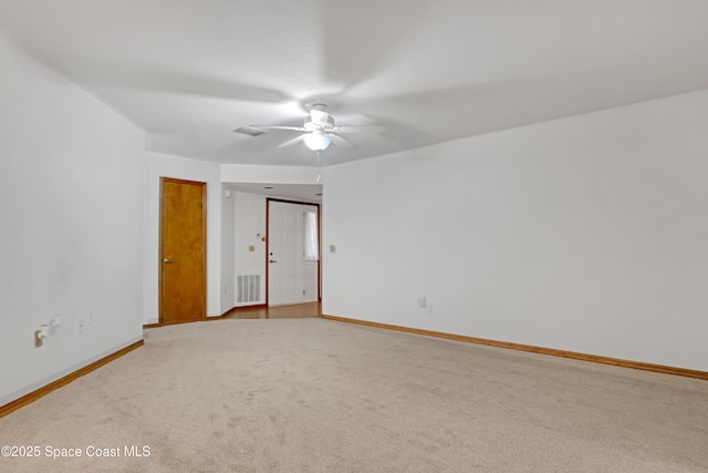 spare room featuring ceiling fan and carpet flooring