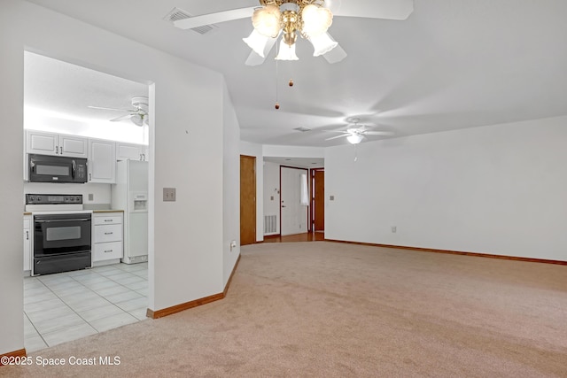 kitchen featuring ceiling fan, white cabinets, black appliances, and light carpet