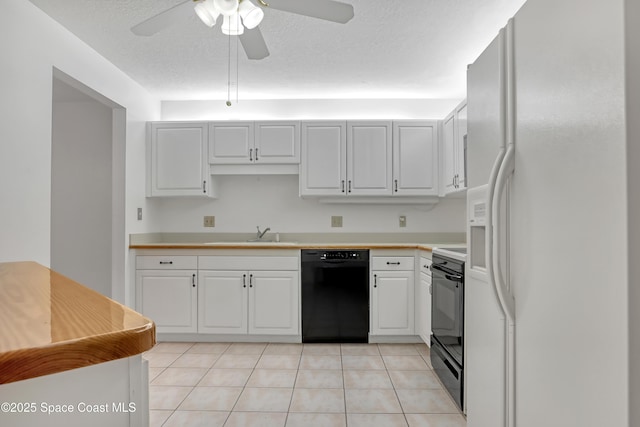 kitchen featuring stove, sink, black dishwasher, white cabinetry, and white fridge with ice dispenser