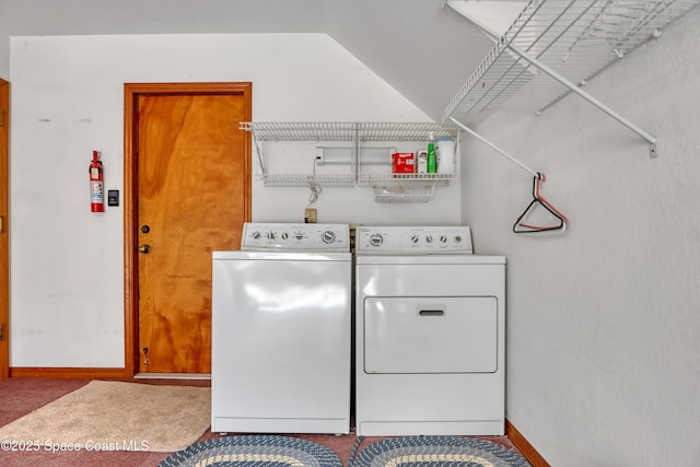 laundry room featuring carpet floors and washing machine and clothes dryer