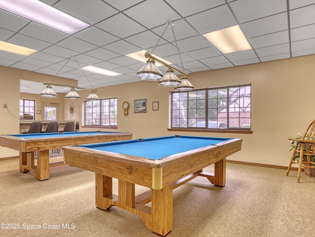 recreation room with billiards, a drop ceiling, and light colored carpet