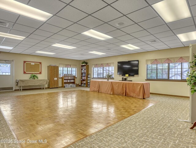 unfurnished living room with parquet flooring