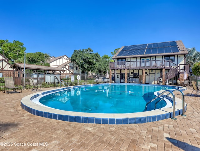 view of swimming pool with a deck