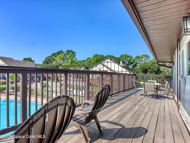 deck with a fenced in pool