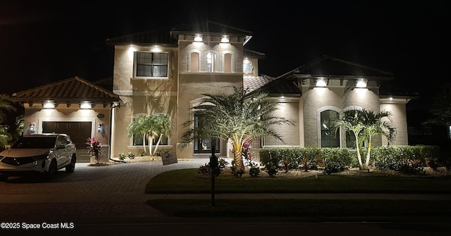 view of front of property featuring a garage