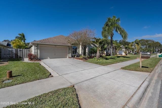 view of front facade with a front yard and a garage