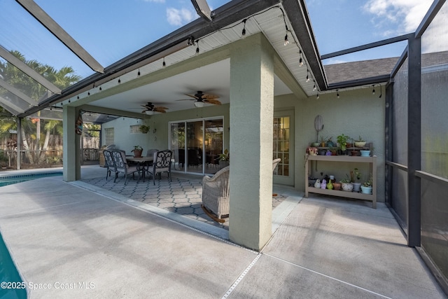 view of patio / terrace featuring glass enclosure