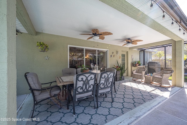 view of patio featuring ceiling fan