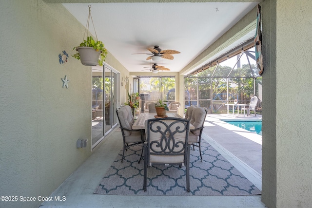 sunroom featuring plenty of natural light and ceiling fan