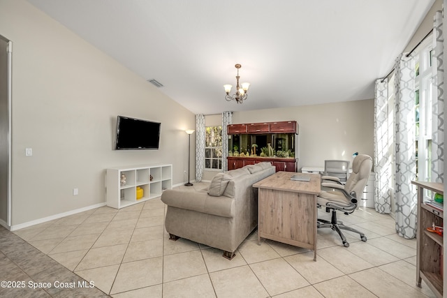 living room featuring light tile patterned flooring, lofted ceiling, a wealth of natural light, and an inviting chandelier