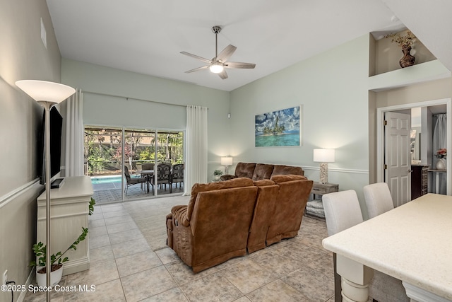 tiled living room featuring ceiling fan