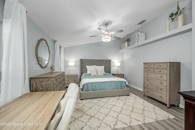 bedroom featuring hardwood / wood-style flooring and ceiling fan