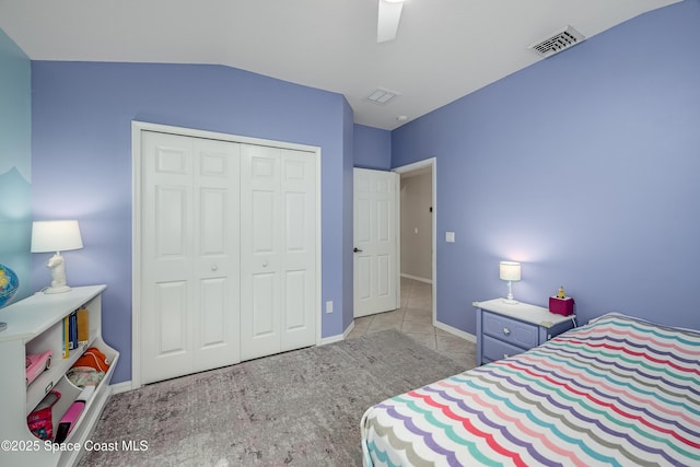 bedroom featuring ceiling fan, a closet, and vaulted ceiling