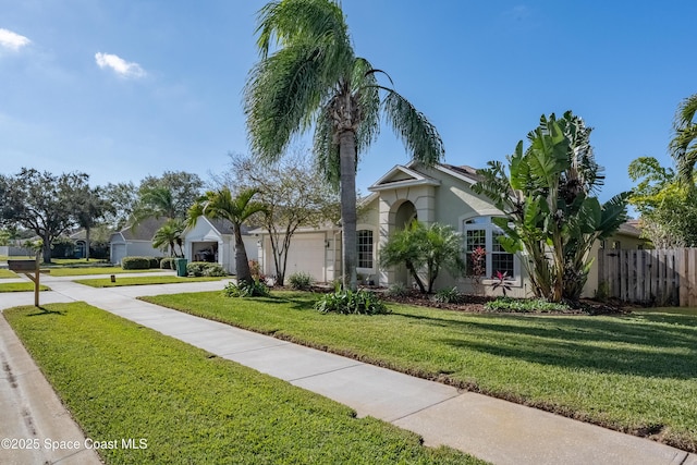 view of front facade with a front lawn and a garage