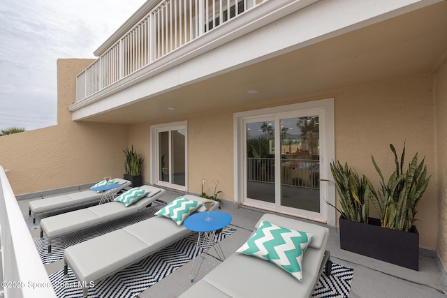 view of patio featuring a balcony