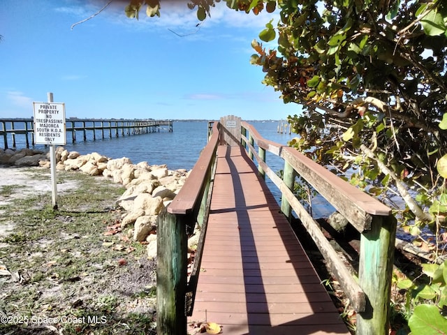 dock area featuring a water view