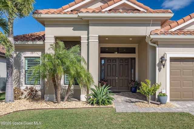 doorway to property featuring a garage