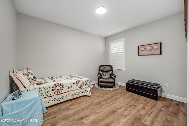 bedroom with hardwood / wood-style flooring