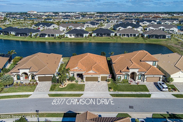 drone / aerial view with a water view