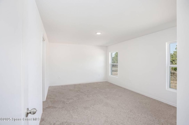 empty room with light colored carpet