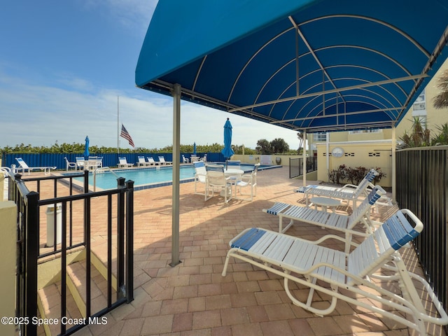 view of patio featuring a community pool