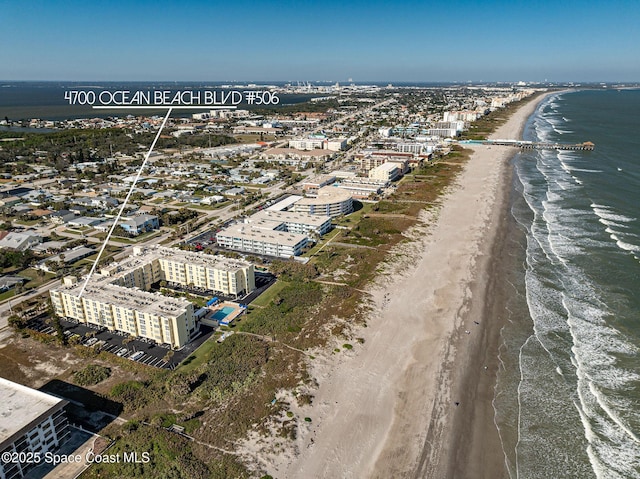 bird's eye view featuring a beach view and a water view