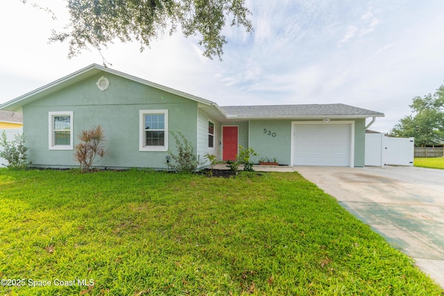 single story home with a front yard and a garage