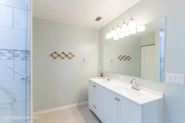 bathroom with vanity and tile patterned flooring