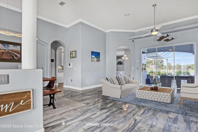 living room featuring wood-type flooring, ceiling fan, and ornamental molding