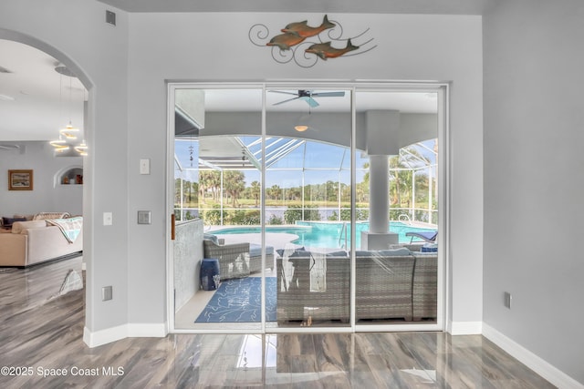 interior space with ceiling fan