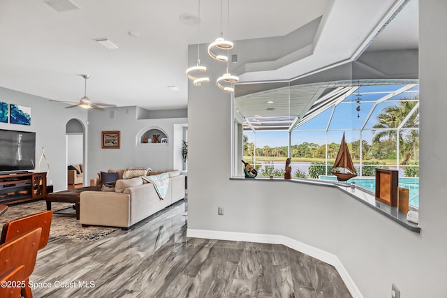 living room featuring hardwood / wood-style floors and ceiling fan