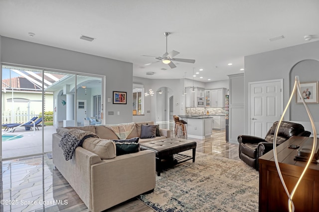 living room featuring ceiling fan