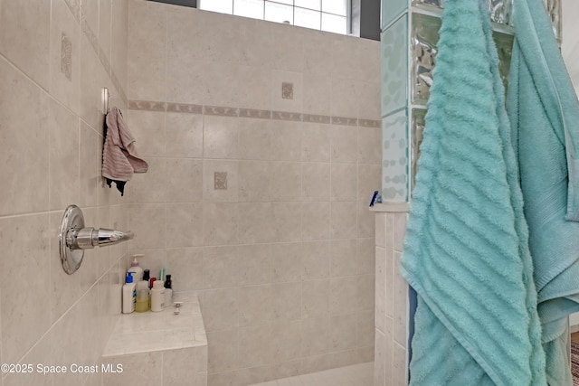 bathroom featuring tiled shower