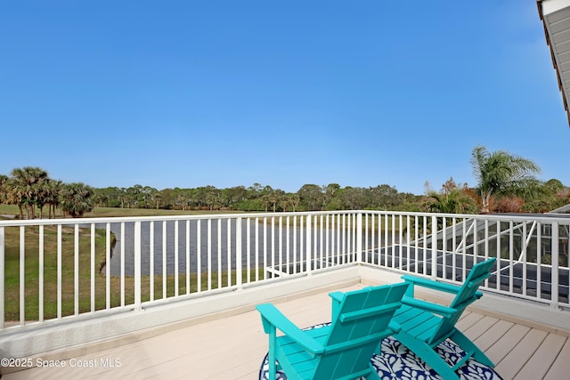 wooden deck featuring a water view