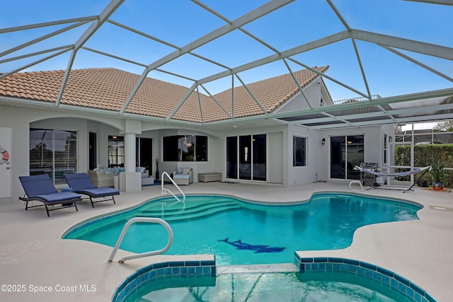 view of pool featuring a patio and a lanai