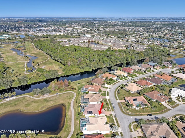 birds eye view of property with a water view