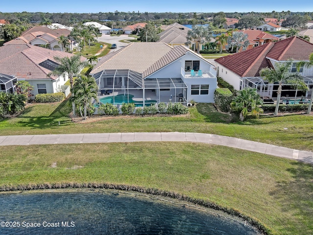 birds eye view of property with a water view