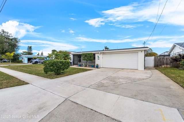 view of front of property featuring a garage and a front yard