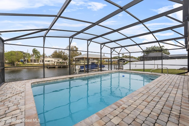 view of swimming pool featuring a water view, a dock, and glass enclosure