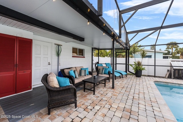 view of patio featuring outdoor lounge area, a lanai, and a fenced in pool