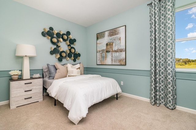 bedroom featuring light carpet