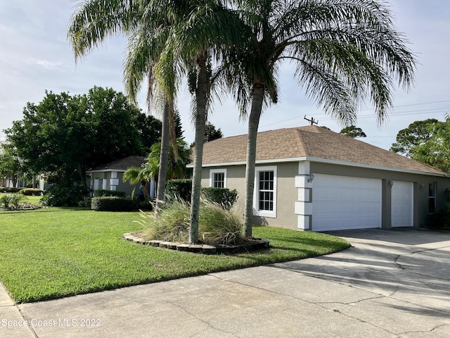 ranch-style home featuring a front lawn and a garage